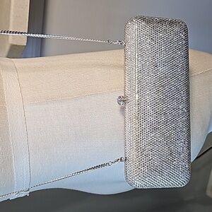 Silver sparkle evening bag. Solid chain. Snap open. Good used condition.